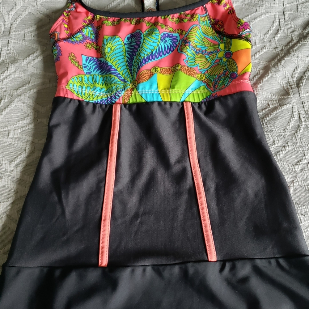 B. SKINS TOP